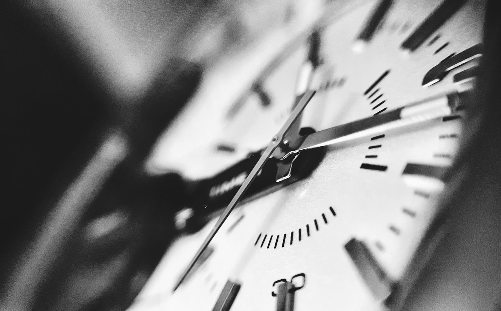 Photo by noor Younis grayscale photography of clock